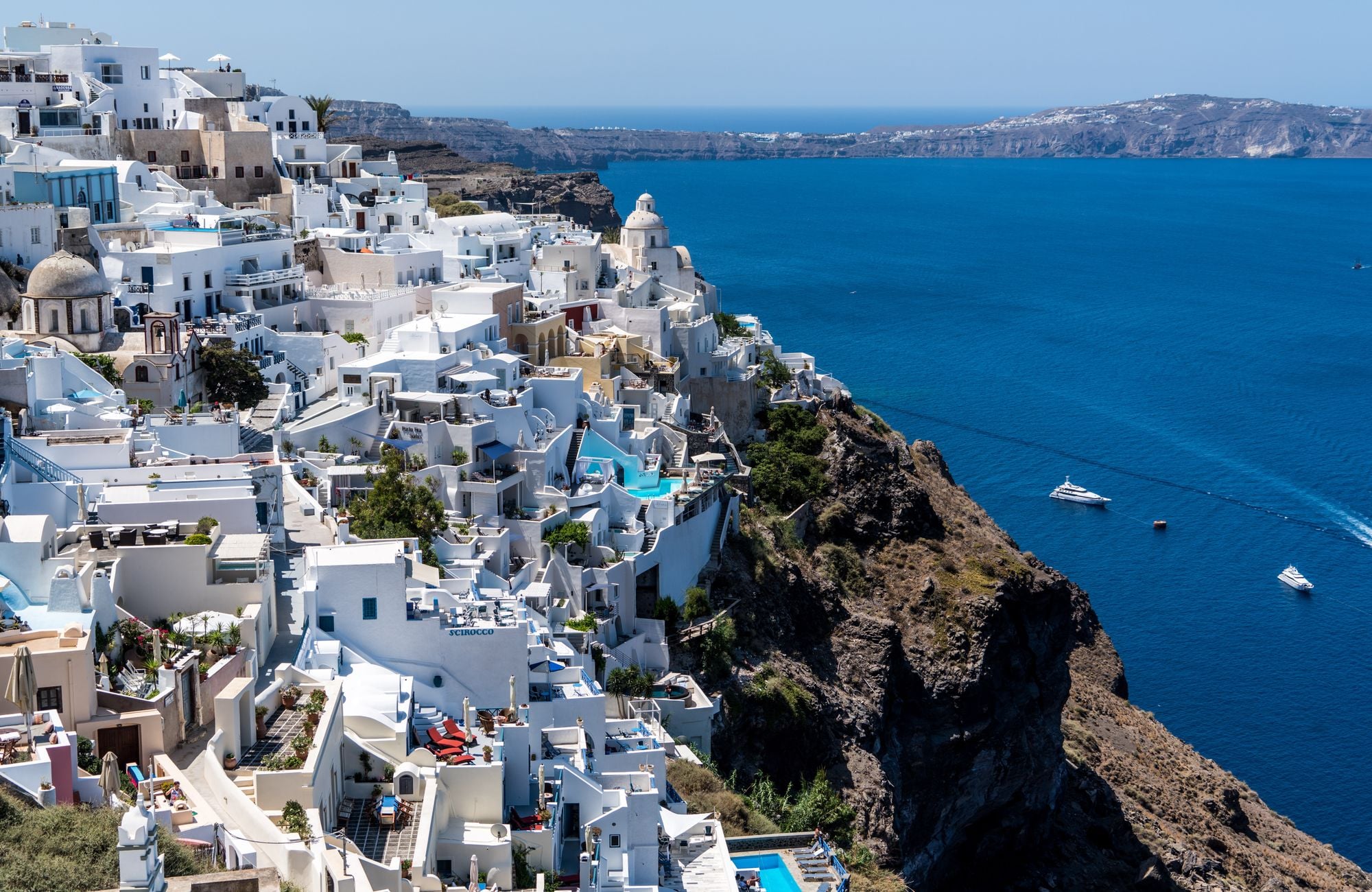 Whitewashed cliffside town above the Aegean Sea in Santorini, Greece