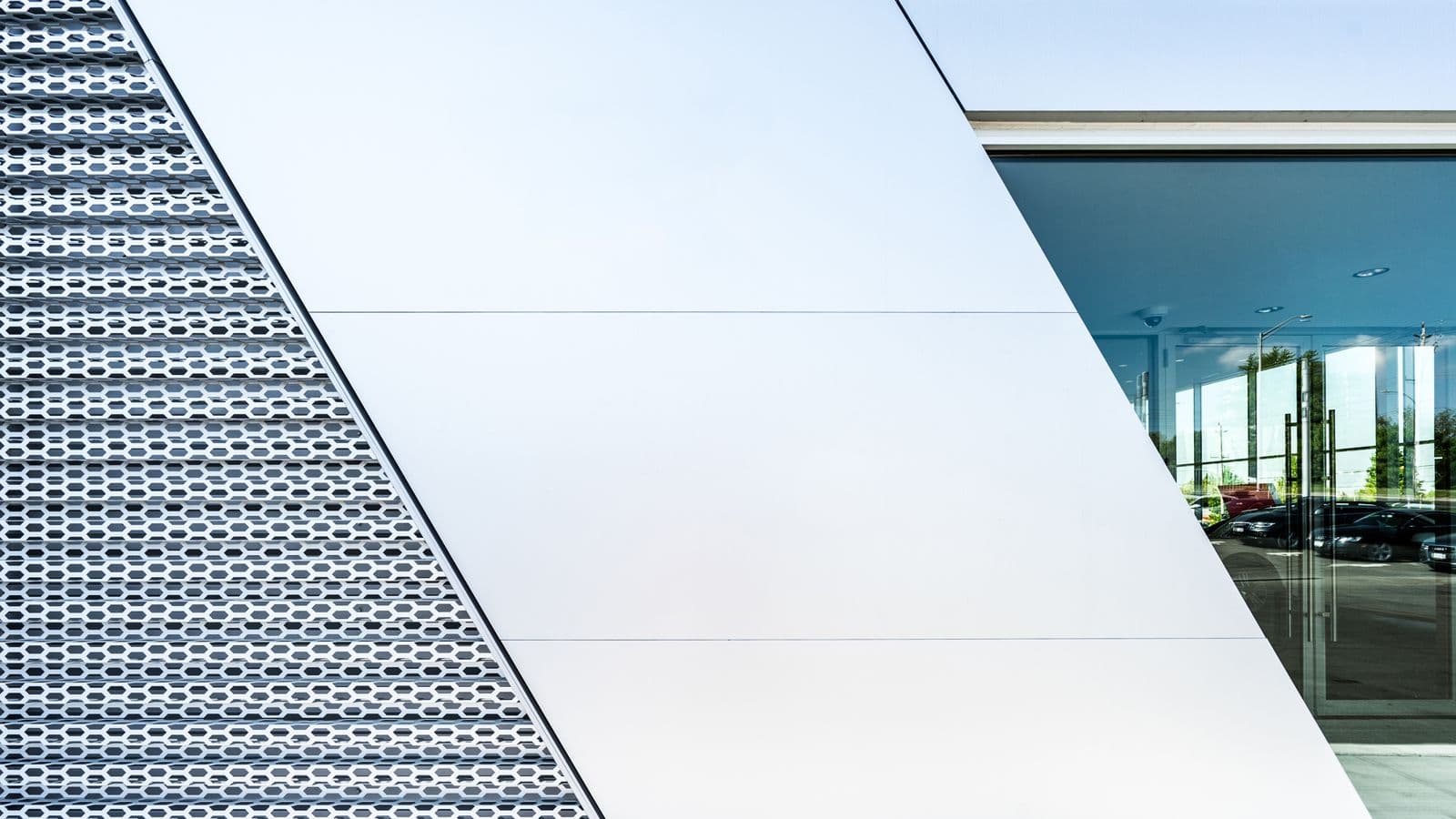 Architectural blueprint on a wooden table with brass drafting tools and soft natural light